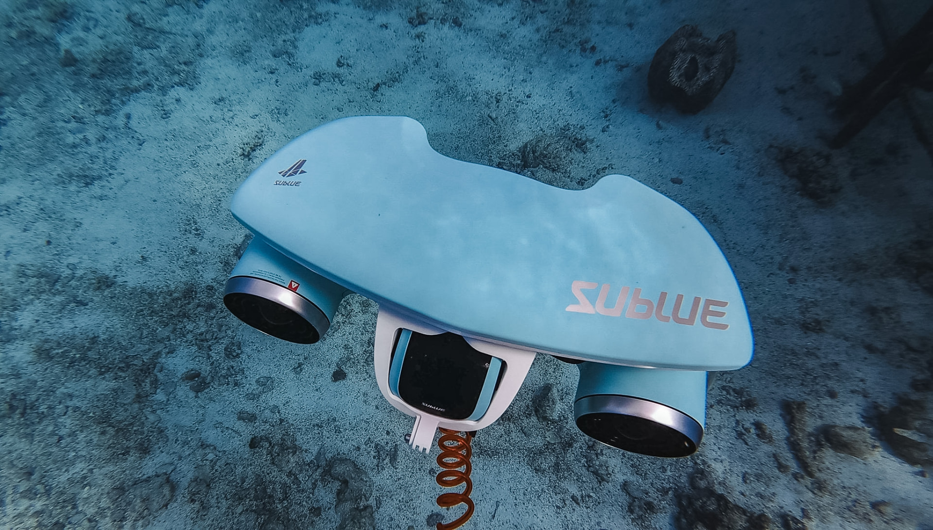 Sea scooter resting on the sandy lagoon floor