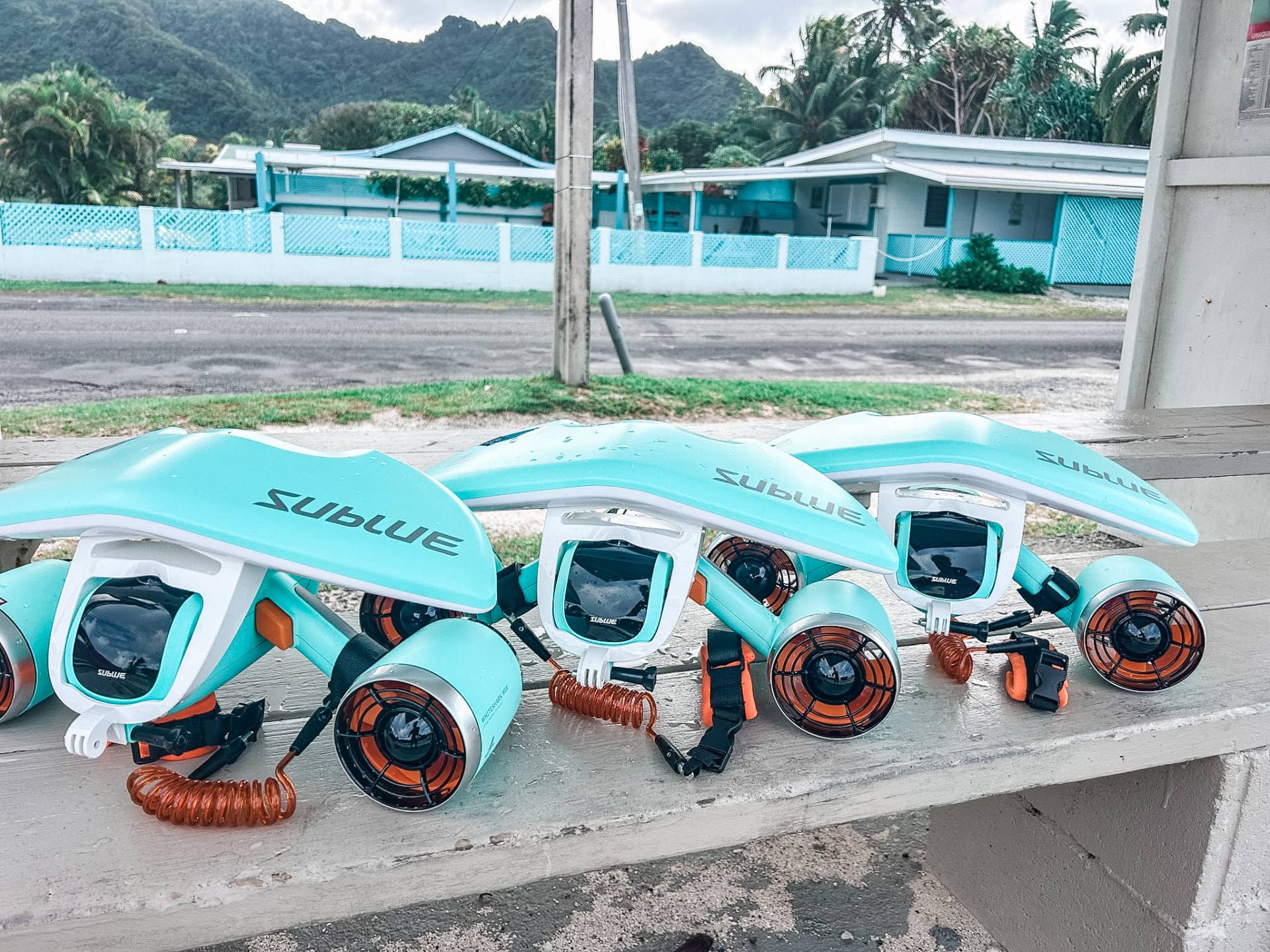 Sea scooters lined up with the Rarotonga mountains behind