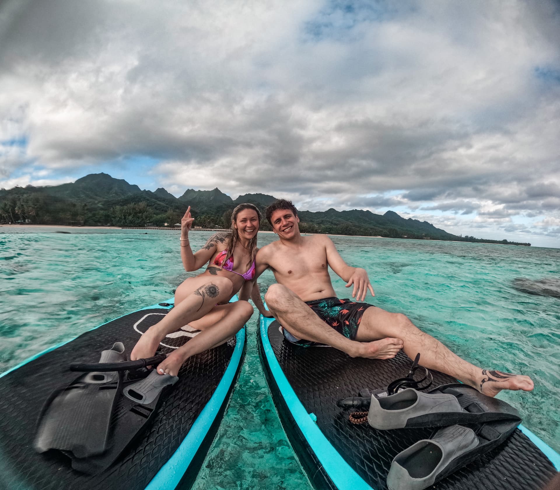 Couple relaxing on boards after a snorkel session